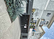 Thumbnail 19 of 19 - a view of a gated garage and apartment building at The Marq Apartments LLC, California, 90042