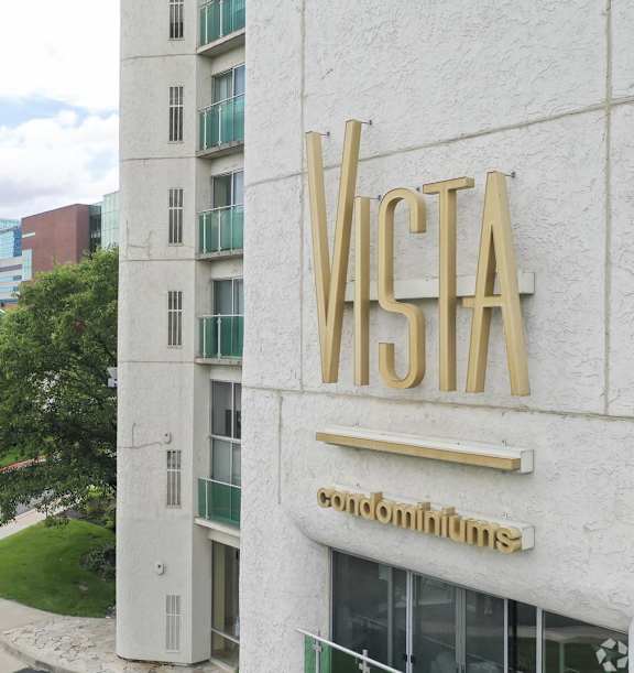 Facade of building with logo on it at Vista Condominiums, Kansas City, Kansas