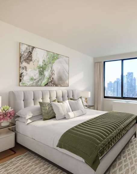A bedroom with a large bed and a large window overlooking the city.at 301E94, New York, NY