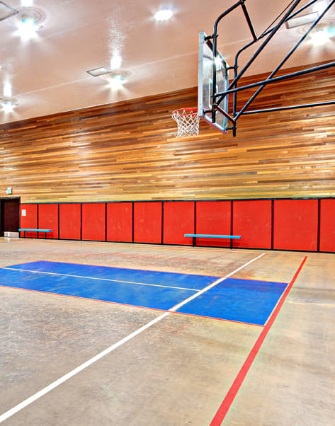 Chambers Creek Estates indoor basketball court with a basketball hoop