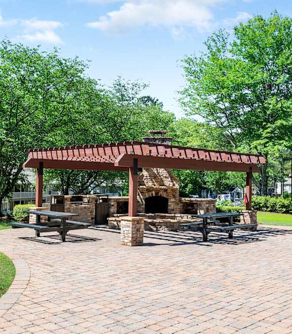 Outdoor patio with fireplace at Creekside at White Oak in Newnan, GA, 30265