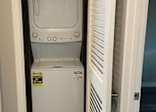 Thumbnail 17 of 19 - A microwave oven is installed in a kitchen cabinet.