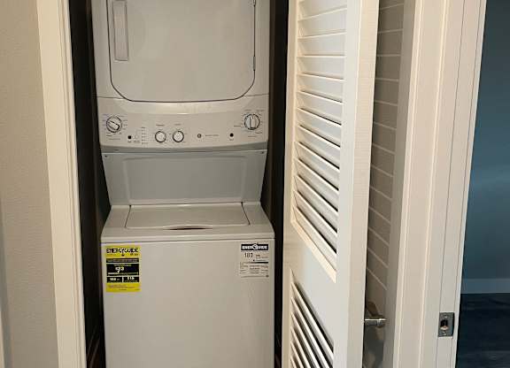 A microwave oven is installed in a kitchen cabinet.