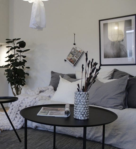 A small living room with a couch and a table.