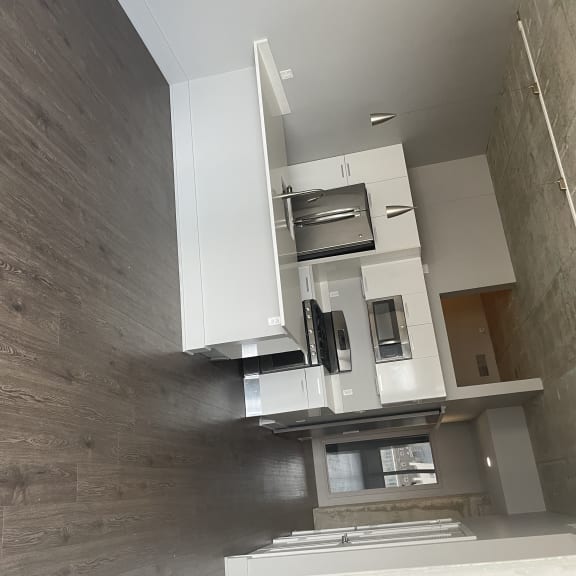Airy living rooms with generous cabinets, granite counter tops and stainless steel appliance fill the kitchen space.