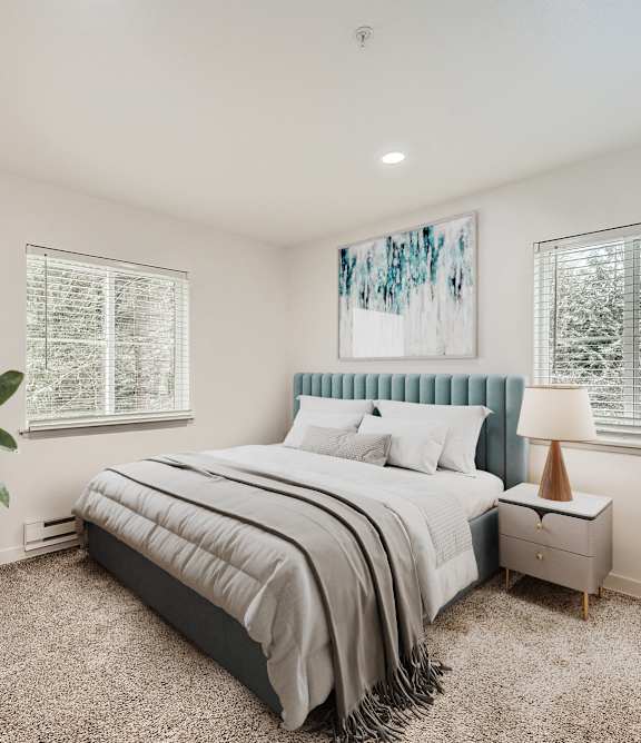 a bedroom with a bed and a painting on the wall