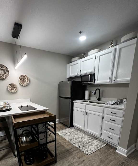 an overhead view of a kitchen and a living room from above