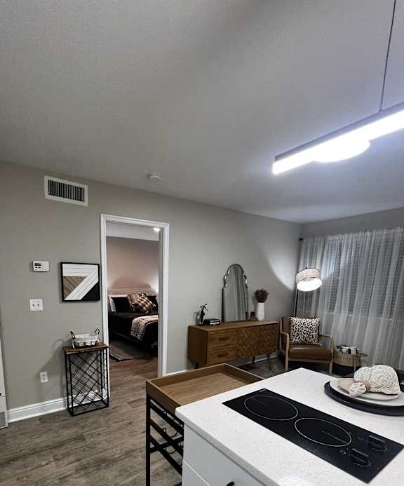 an overhead view of a kitchen and living room with a washer and dryer