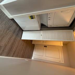 a small bathroom with a washer and dryer in it