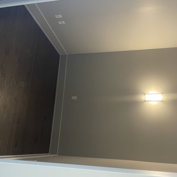 A midsize flex space that would make for an excellent office, second closet or dressing room complete with natrual and artifical lighting that can be closed off with a large "barn style" door.