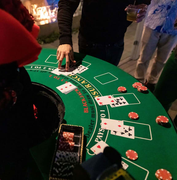 a group of people playing poker at a casino table
