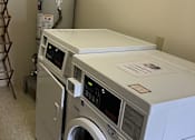 Thumbnail 20 of 38 - A washing machine is installed in a wall.