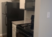 Thumbnail 5 of 14 - Renovated Kitchen with granite at Ryan Place Apartments, Integrity Realty, Ohio, 44240