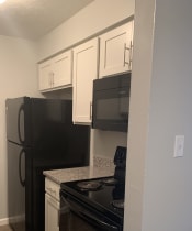 Thumbnail 5 of 14 - Renovated Kitchen with granite at Ryan Place Apartments, Integrity Realty, Ohio, 44240
