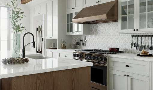 A kitchen with white cabinets and a wooden island.