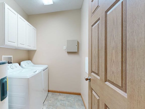 a laundry room with a washer and dryer in it