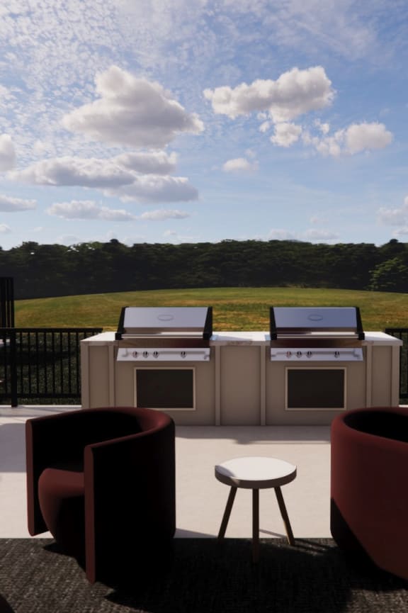 A patio with a table, chairs, and a grill. at Sandhill Parkway Townhomes Apartments, East Bethel, Minnesota