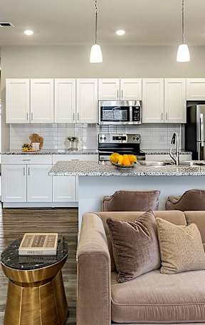 Kitchen along with living room at Sandstone Villas Apartments, Omaha, 68116