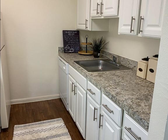 This is a photo of the kitchen of a 1245 square foot 2 bedroom apartment at Cambridge Court Apartments in Dallas, TX.