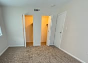 Thumbnail 15 of 18 - a hallway with a stone wall and a window on the floor at Hidden Brook Apartment Homes Apartments, New Bedford, MA, 02740
