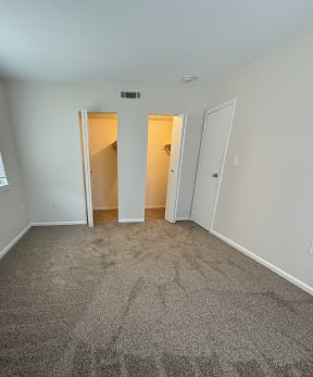 a hallway with a stone wall and a window on the floor at Hidden Brook Apartment Homes Apartments, New Bedford, MA, 02740