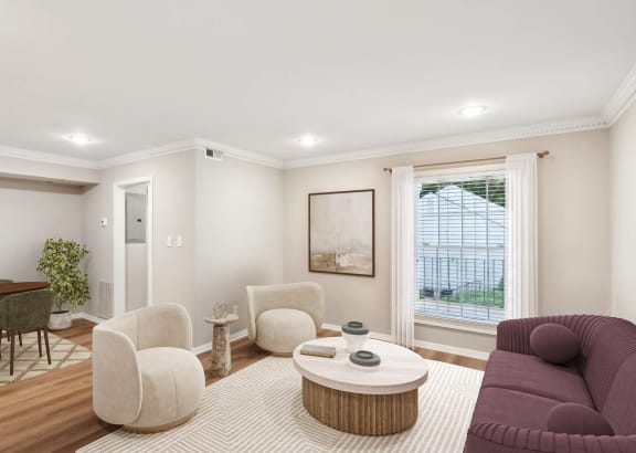a living room with a couch and chairs and a table at Lake Johnson Mews Apartments, PRG Real Estate Management, Raleigh, 27606
