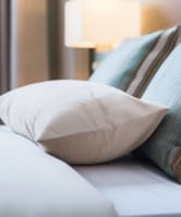 a bedroom with a bed and pillows
