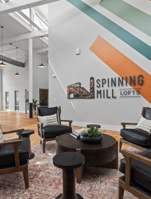 a bedroom with a white bed and a closet at Spinning Mill Lofts, Clayton, NC 27520