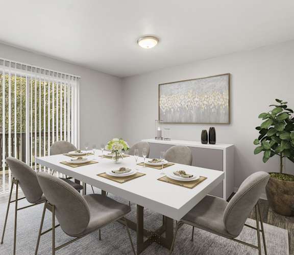a dining room with a white table and chairs at Pinewood Townhomes in Georgia 30084
