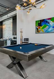 Pool table with art in the background