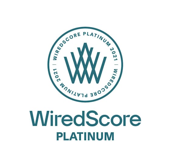 A logo with the text "WiredScore PLATINUM" and a circular emblem with the text "Windscore Platinum" and "WiredScore" written on it.