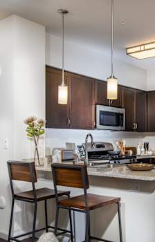a kitchen and dining room with a table and chairs at Capriana at Chino Hills, Chino Hills, CA, 91709