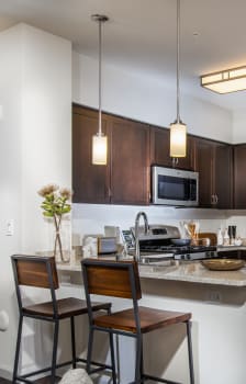 a kitchen and dining room with a table and chairs at Capriana at Chino Hills, Chino Hills, CA, 91709