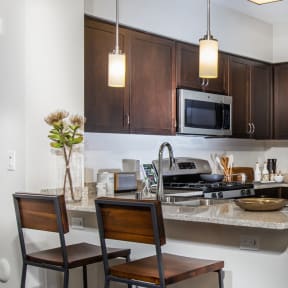 a kitchen and dining room with a table and chairs at Capriana at Chino Hills, Chino Hills, CA, 91709
