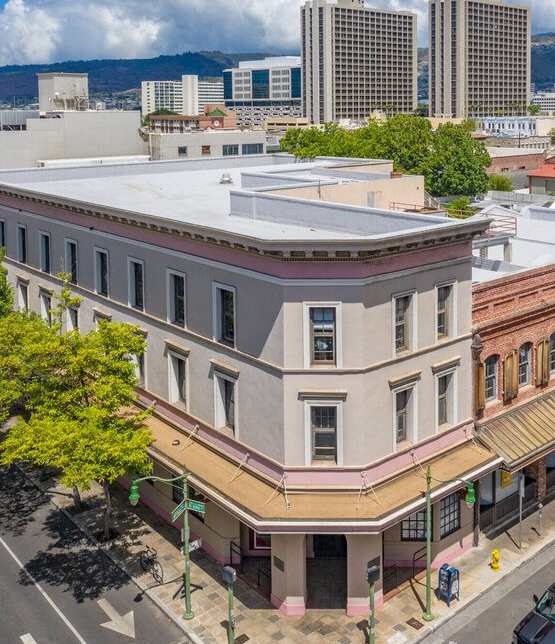 an aerial view of a building on a city street