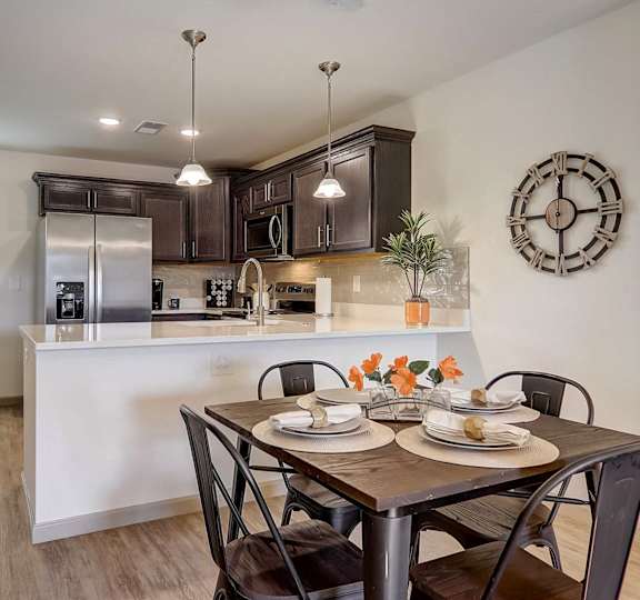 a living room and kitchen with a couch and coffee table