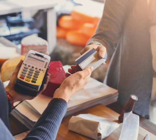 A person paying by credit card