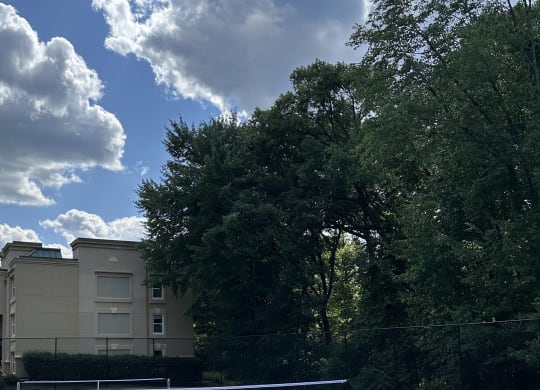 a view of a house from the roof of a tennis court