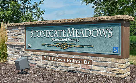 Stone gate meadows apartment homes sign.