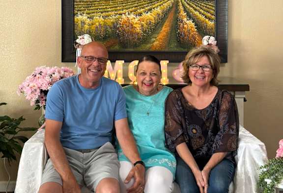 Three people are sitting at Lodi Commons Senior Living, California, 95240