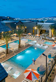 a view of the pool at the resort at night