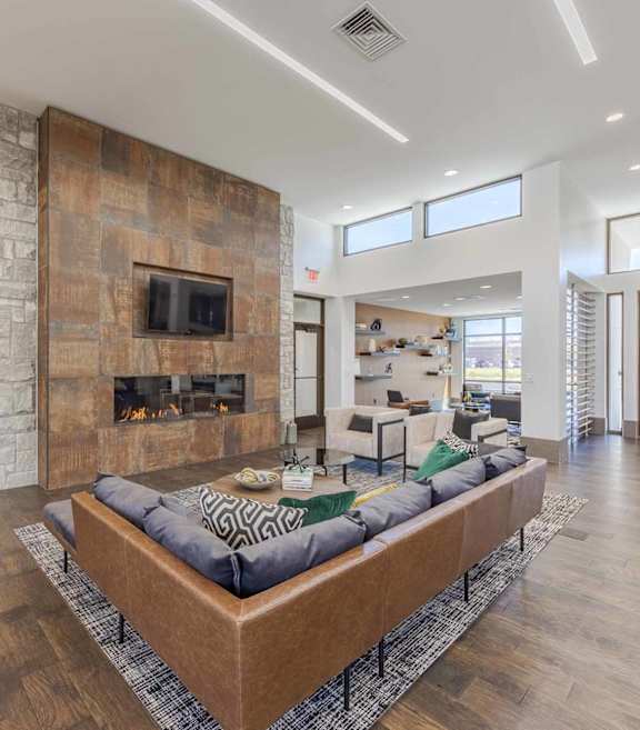 A modern kitchen with a bar stool and a dining table.
