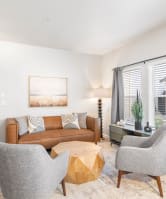 a sofa with white cushions in a living room