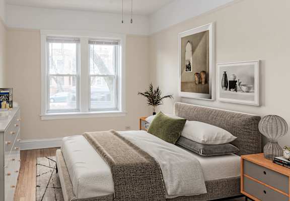 a bedroom with a bed and a ceiling fan