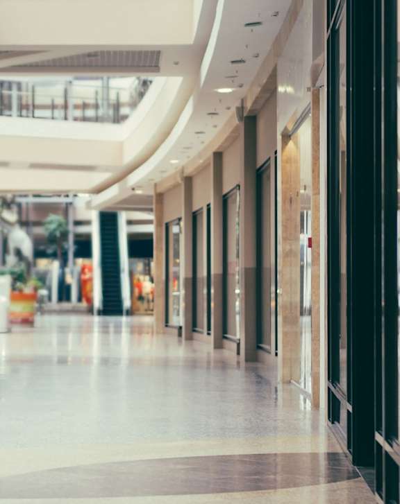 A long hallway with a staircase on the left side.