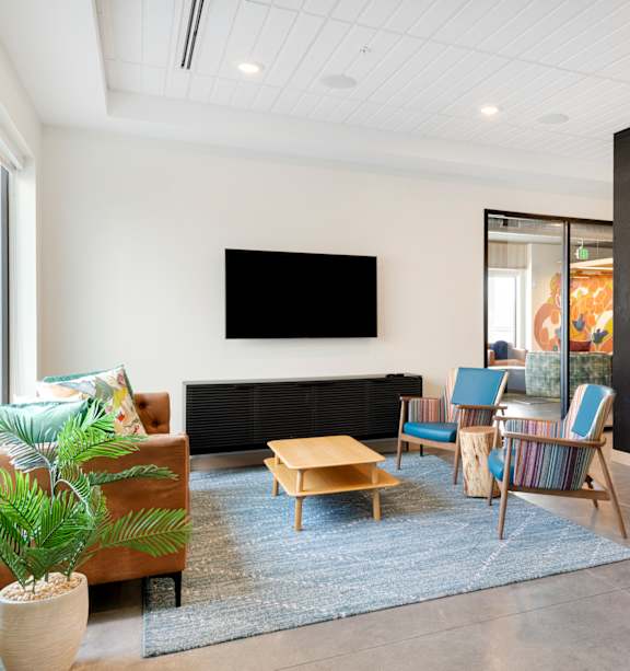 a kitchen with wooden cabinets and a table and chairs  at Zelia on Seven, St Louis Park, MN