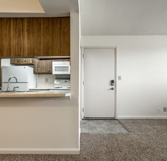a view of a kitchen and a door in a house at Bay Pointe Apartments in Lafayette, 47909