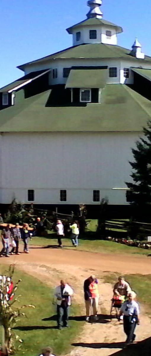 a church with a crowd of people standing around it