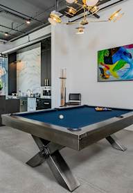 Pool table with art in the background