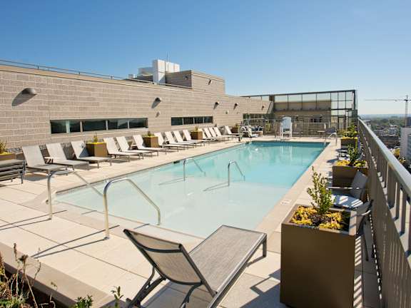 the pool on the rooftop of a building at the ace hotel
